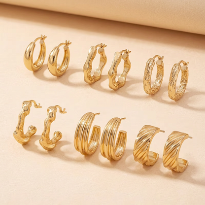 Gold earring set laid flat to show side angles