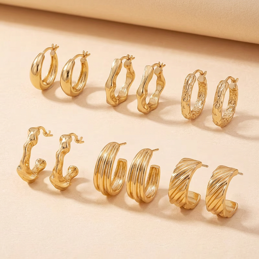 Gold earring set laid flat to show side angles