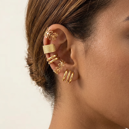 Gold-tone ear cuffs styled on a model