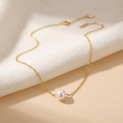 Pearl necklace styled flat-lay