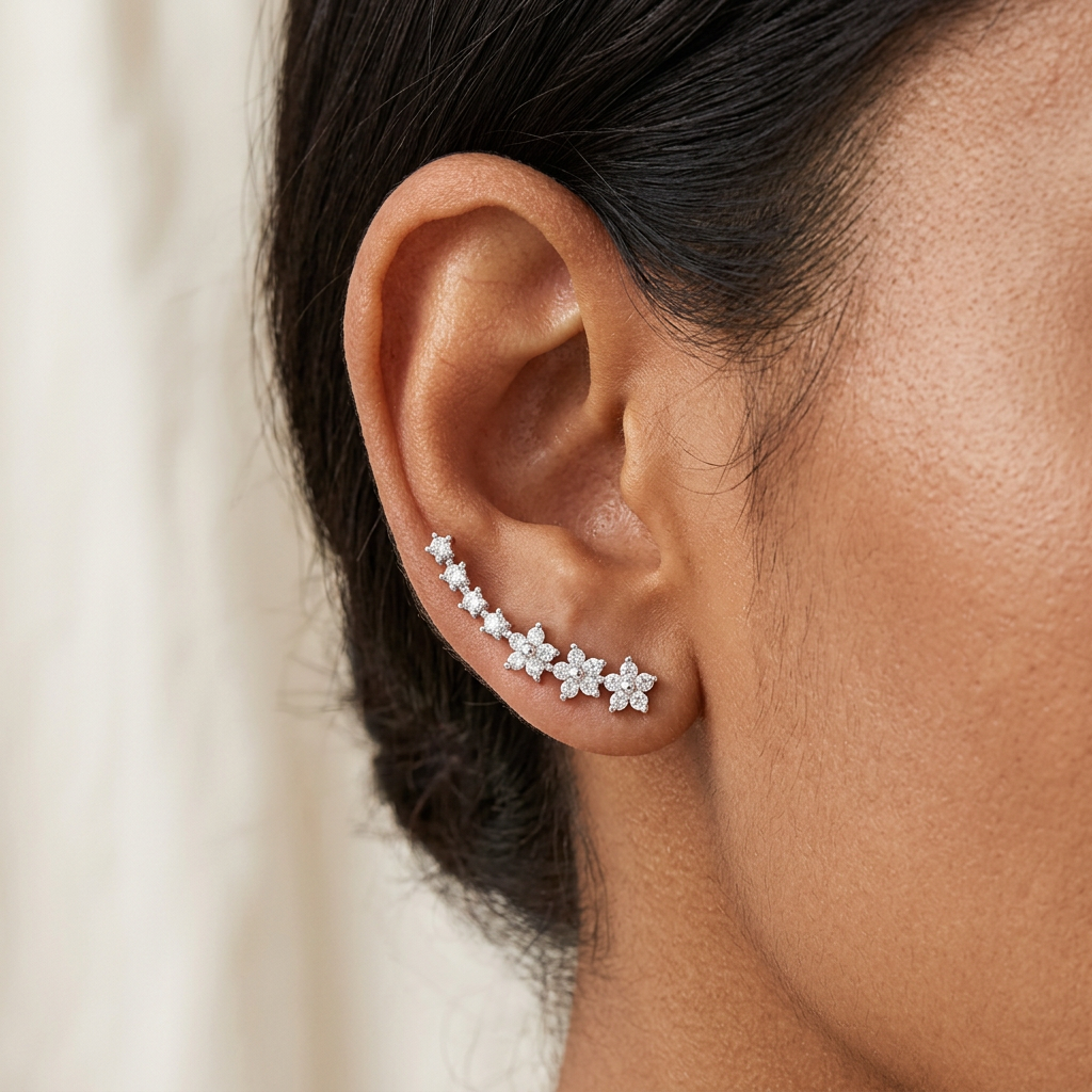 Silver-tone earrings worn by a model